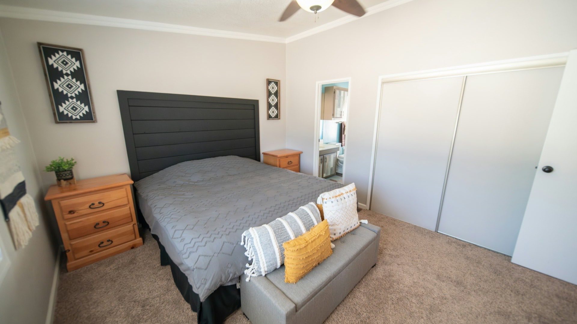 Single-wide mobile home on a Texas lot with a clear sky