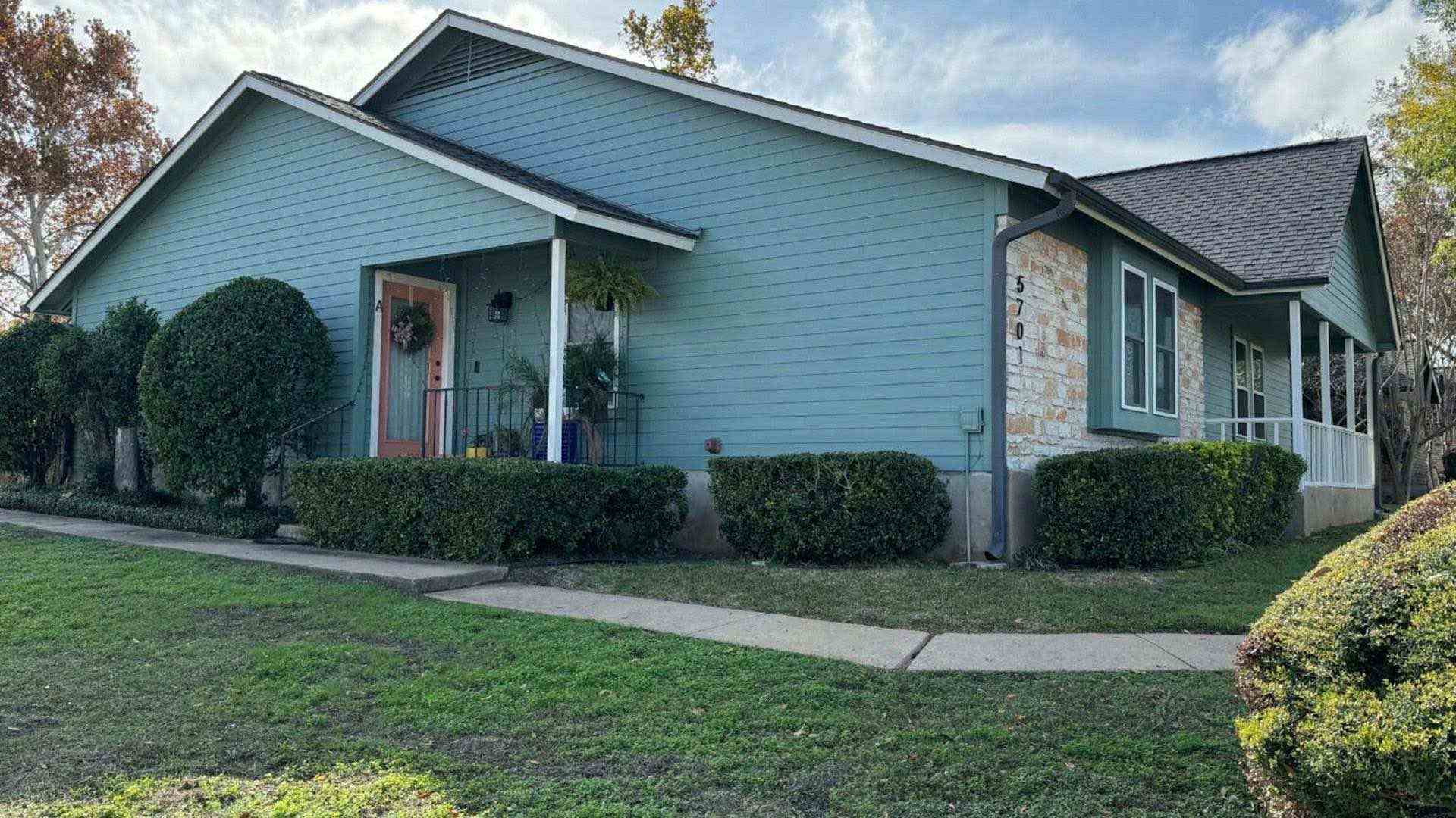 Weathered front porch of an East Texas house in late afternoon light